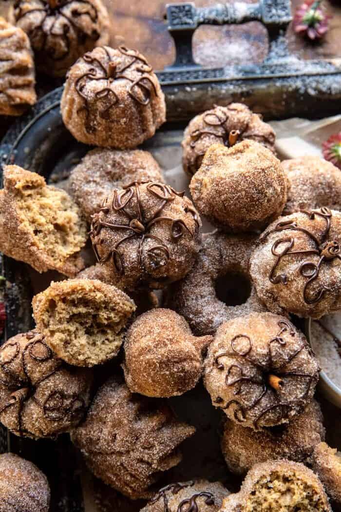 Mini Apple Cider Cakes | halfbakedharvest.com side angled photo of Mini Apple Cider Cakes broken in half to see the center