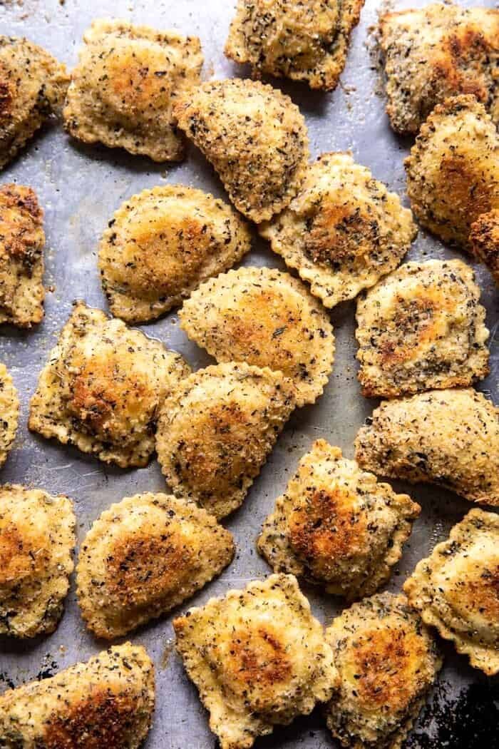 Oven Toasted Garlic Herb Cheese Ravioli | halfbakedharvest.com Oven Toasted Garlic Herb Cheese Ravioli on baking sheet after baking