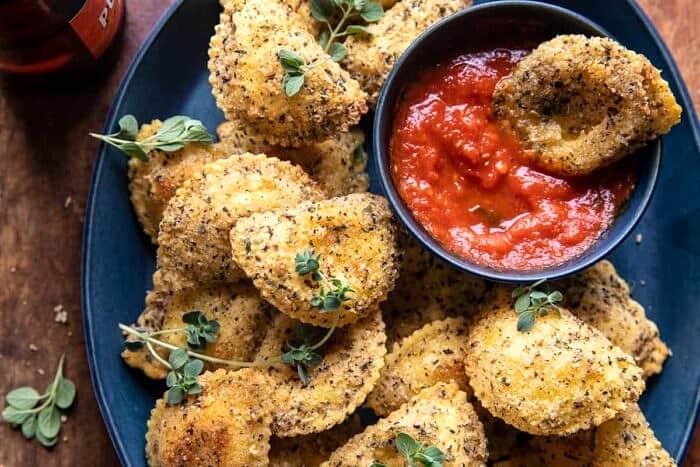 Oven Toasted Garlic Herb Cheese Ravioli | halfbakedharvest.com overhead close up photo of Oven Toasted Garlic Herb Cheese Ravioli