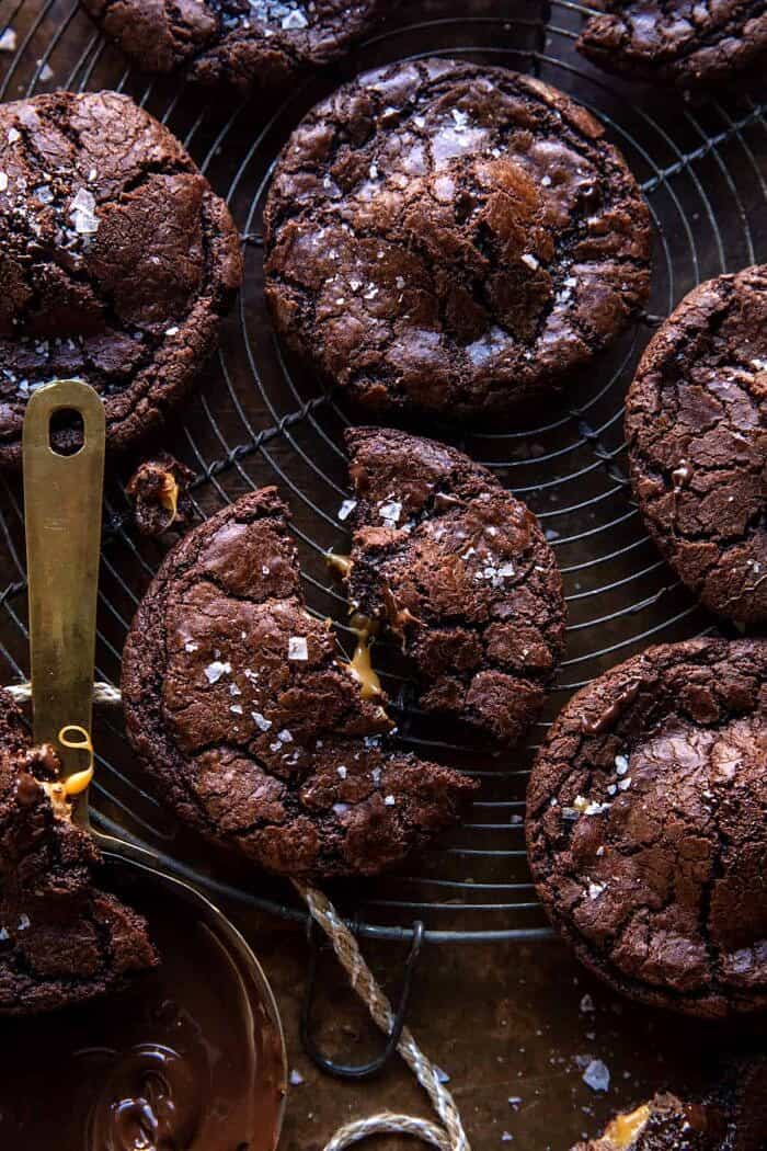 Crinkly Caramel Stuffed Brownie Cookies | halfbakedharvest.com overhead close up photo of Crinkly Caramel Stuffed Brownie Cookies