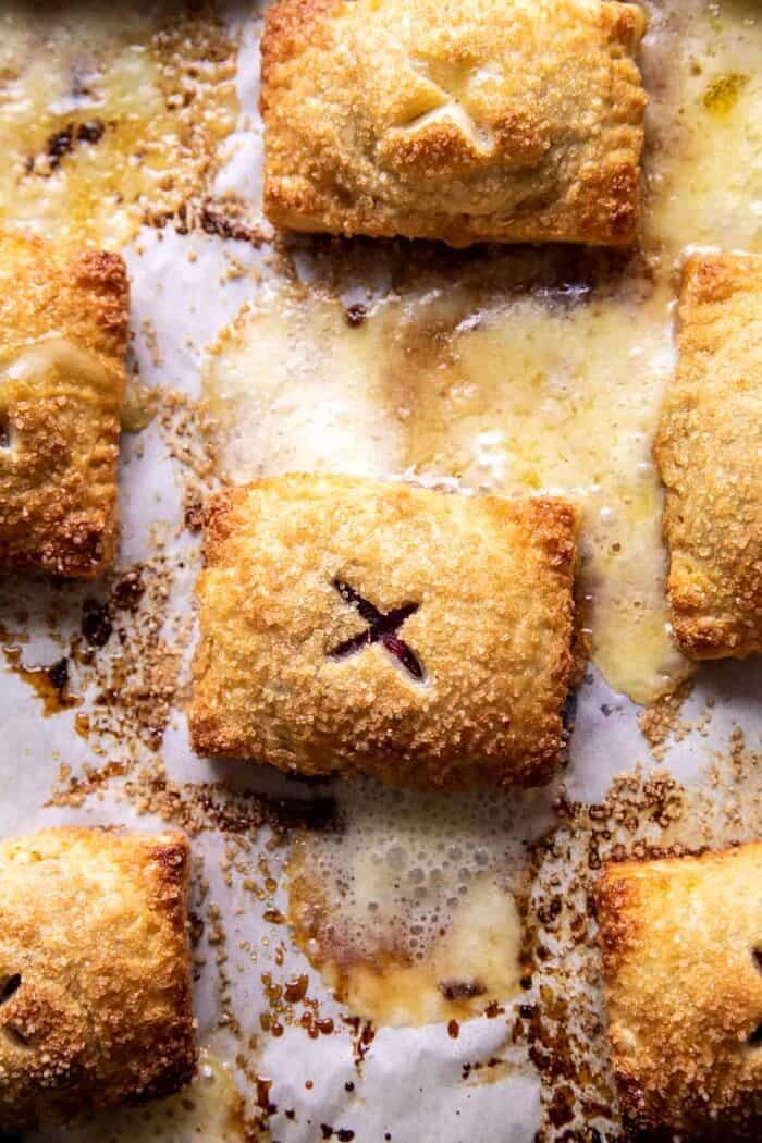 Pastry Wrapped Cranberry Baked Brie Bites | halfbakedharvest.com Pastry Wrapped Cranberry Baked Brie Bites on baking sheet