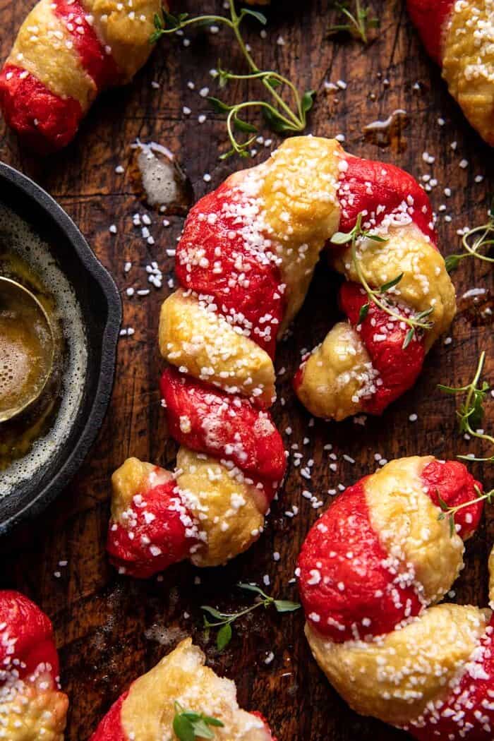 Salted Garlic Butter Candy Cane Bagels | halfbakedharvest.com overhead close up photo of Salted Garlic Butter Candy Cane Bagels