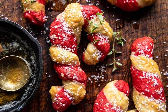 Salted Garlic Butter Candy Cane Bagels | halfbakedharvest.com overhead horizontal photo of Salted Garlic Butter Candy Cane Bagels