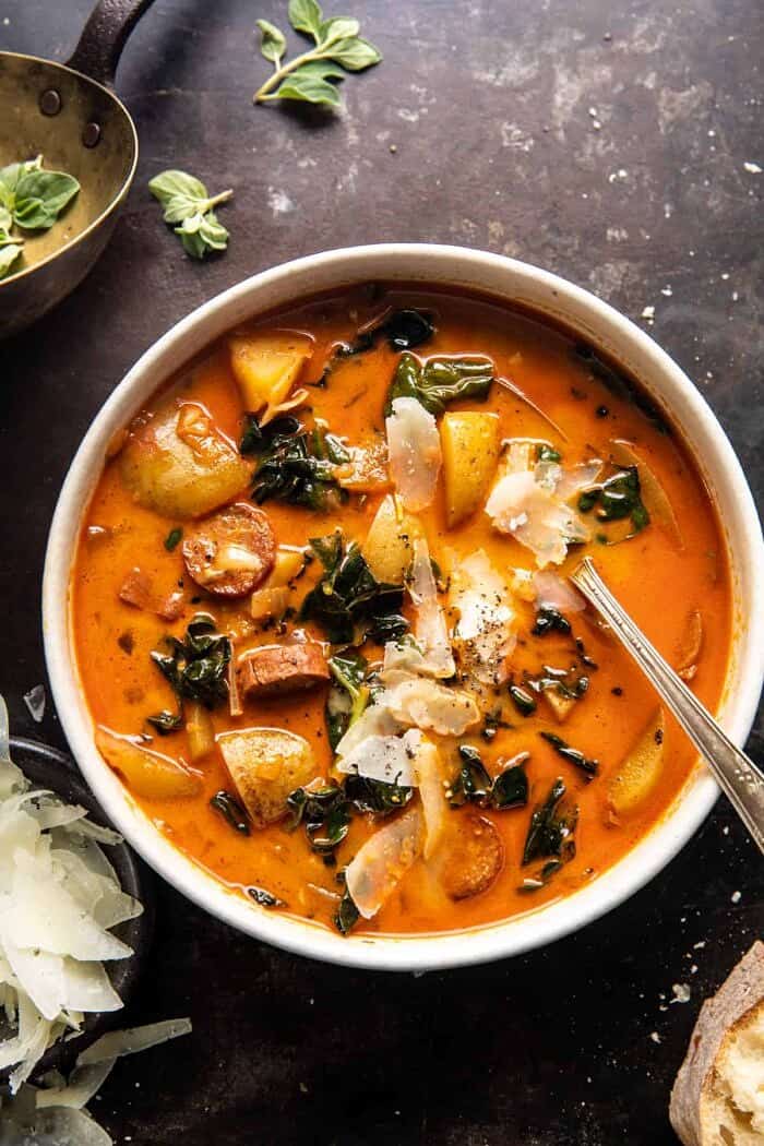 overhead photo of Smoky Potato and Kale Soup with spoon in bowl 