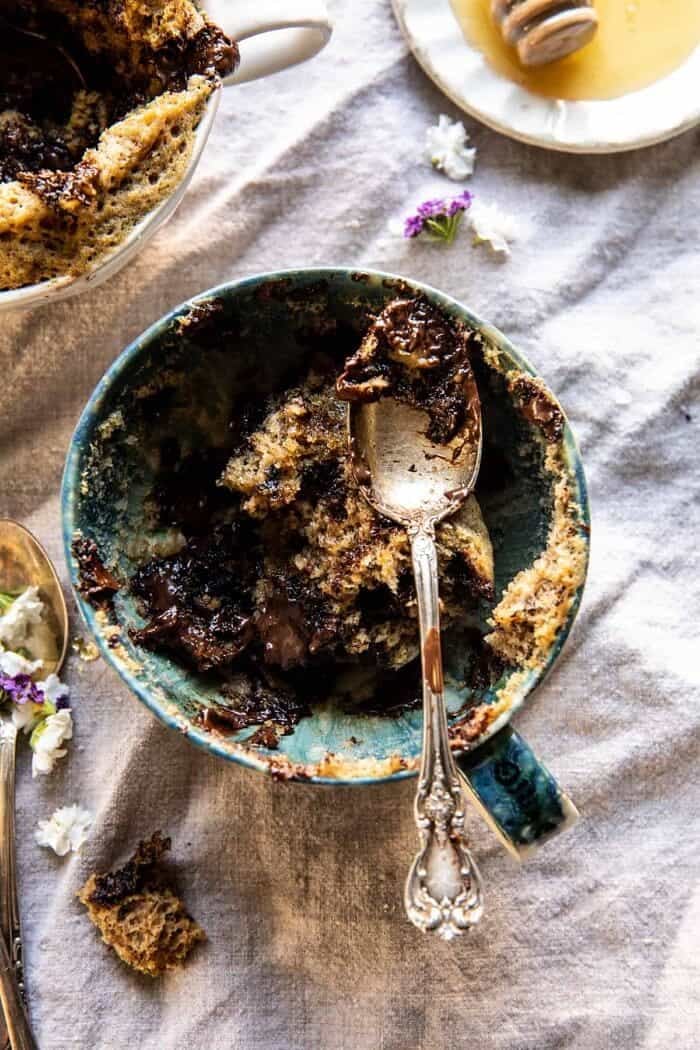 5 Minute Chocolate Chunk Banana Bread Mug Cake | halfbakedharvest.com overhead photo of eaten 5 Minute Chocolate Chunk Banana Bread Mug Cake