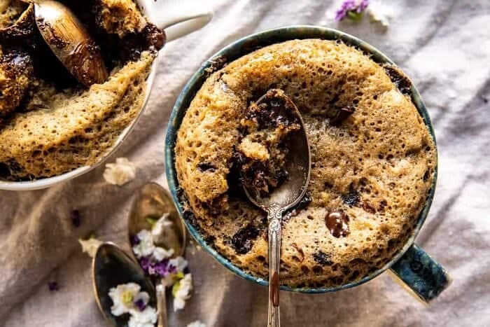 5 Minute Chocolate Chunk Banana Bread Mug Cake | halfbakedharvest.com overhead horizontal photo of 5 Minute Chocolate Chunk Banana Bread Mug Cake