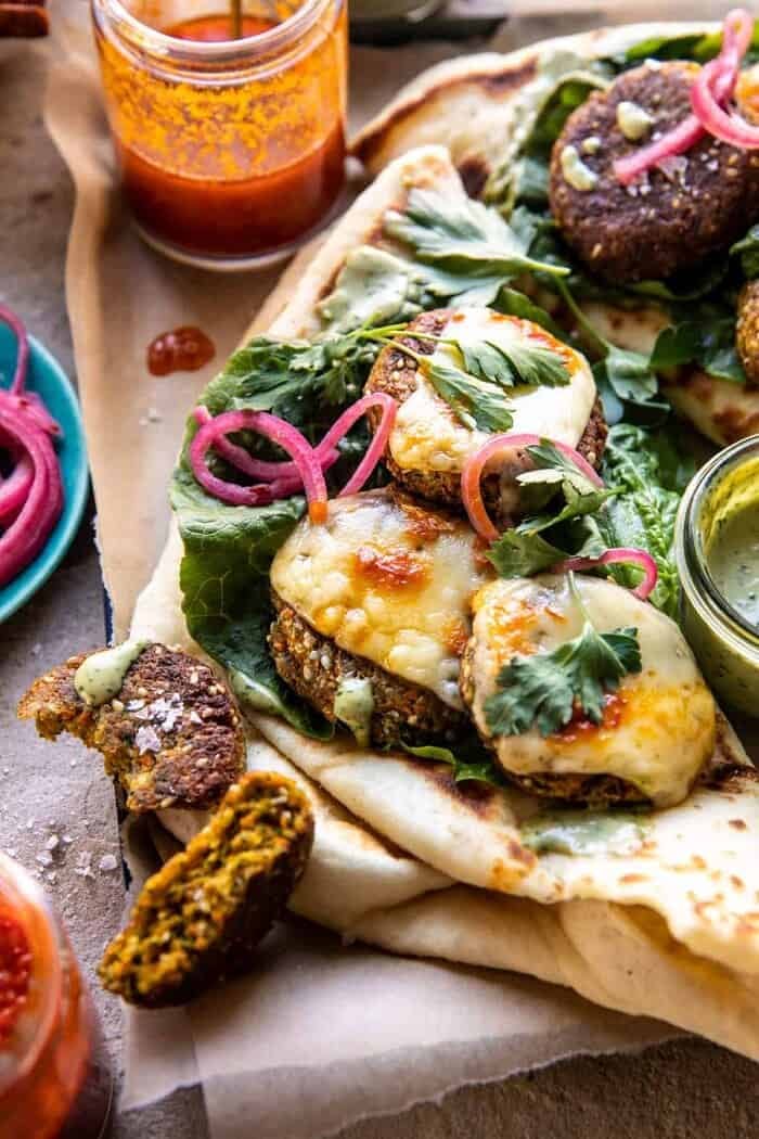 side angled photo of Crispy Sesame Falafel Melts with Garlicky Green Tahini 