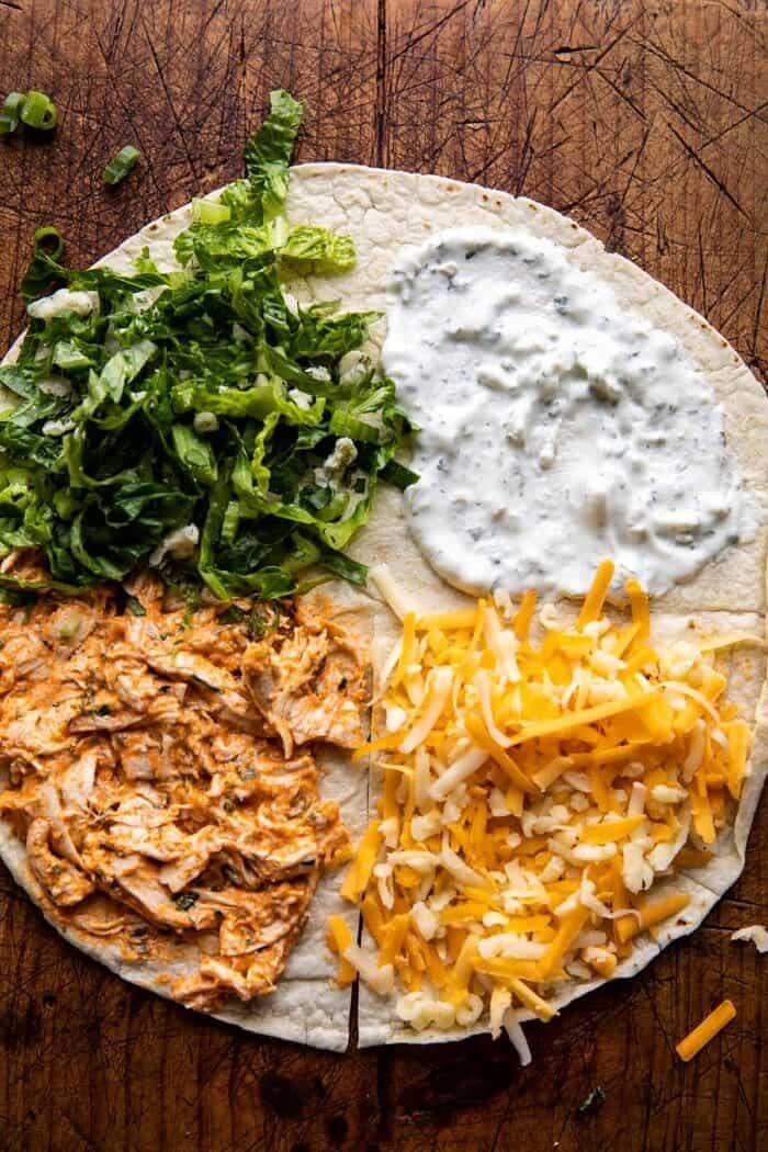 Folded Crispy Buffalo Chicken Wraps | halfbakedharvest.com prep photo of folding the wraps