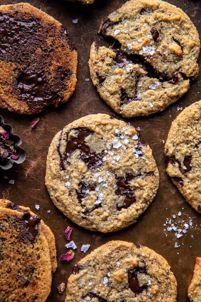 Salted Tahini Butter Chocolate Chip Cookies | halfbakedharvest.com overhead close up photo of Salted Tahini Butter Chocolate Chip Cookies