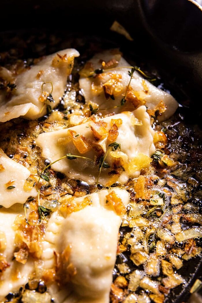 Broccoli Cheddar Potato Pierogi cooking in skillet 