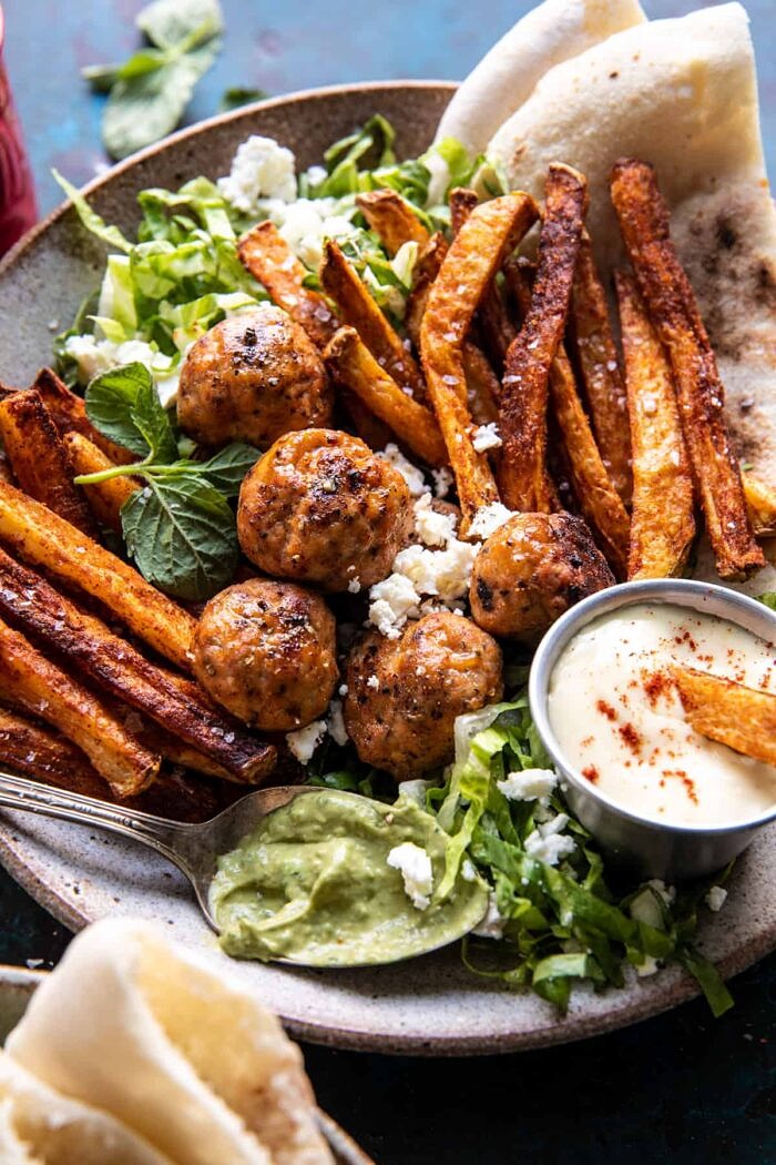 close up photo of Chicken Meatball Pita Bowls with Seasoned Fries and Feta 