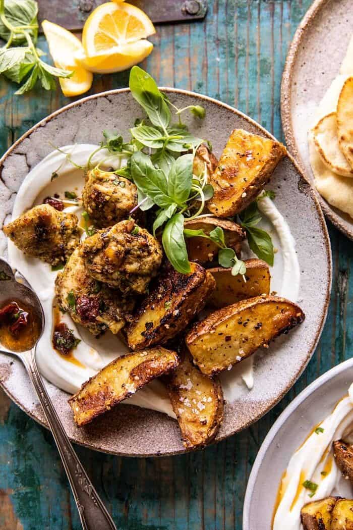 overhead photo of Sheet Pan Pesto Chicken and Lemon Butter Potatoes with Whipped Feta 