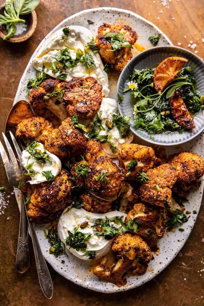 overhead photo of Crispy Roasted Blackened Cauliflower with Burrata and Herbs