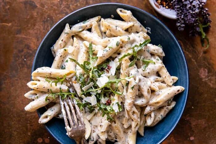 One Pot Creamy Penne Alfredo with Spicy Arugula | halfbakedharvest.com