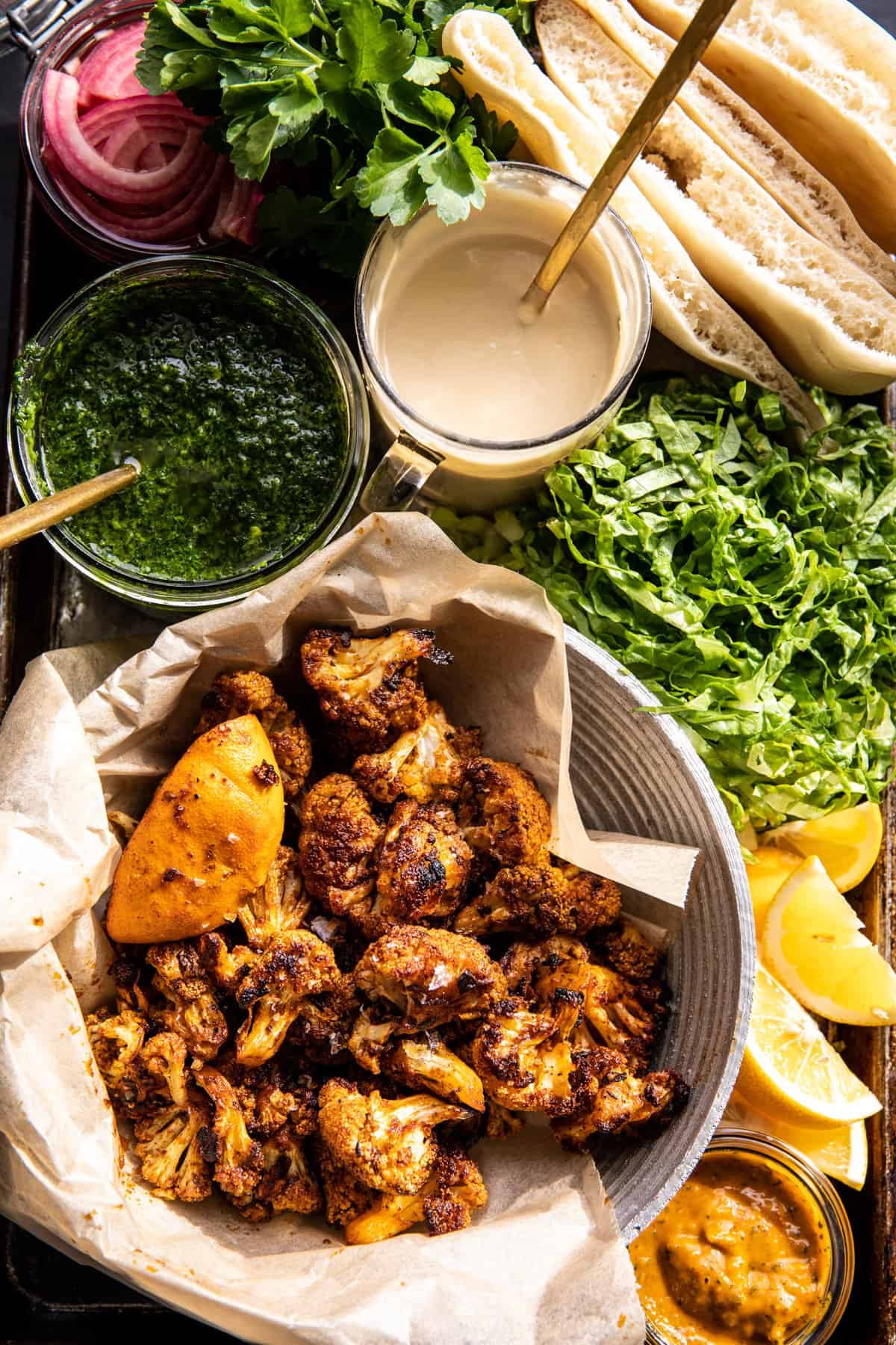 Roasted Cauliflower Pitas with Zhug and Garlic Tahini | halfbakedharvest.com