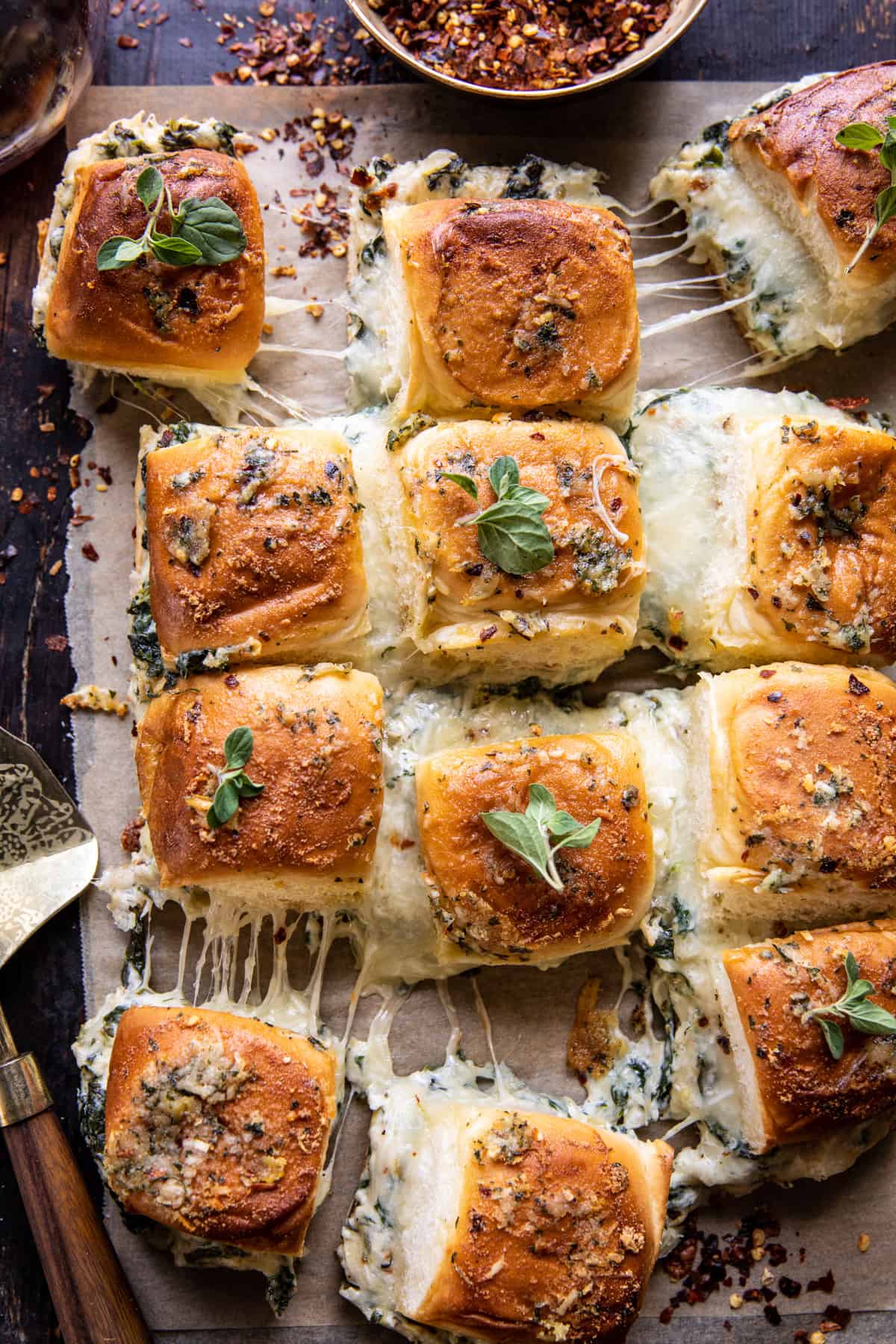 Pull Apart Garlic Butter Spinach and Artichoke Dip Sliders | halfbakedharvest.com