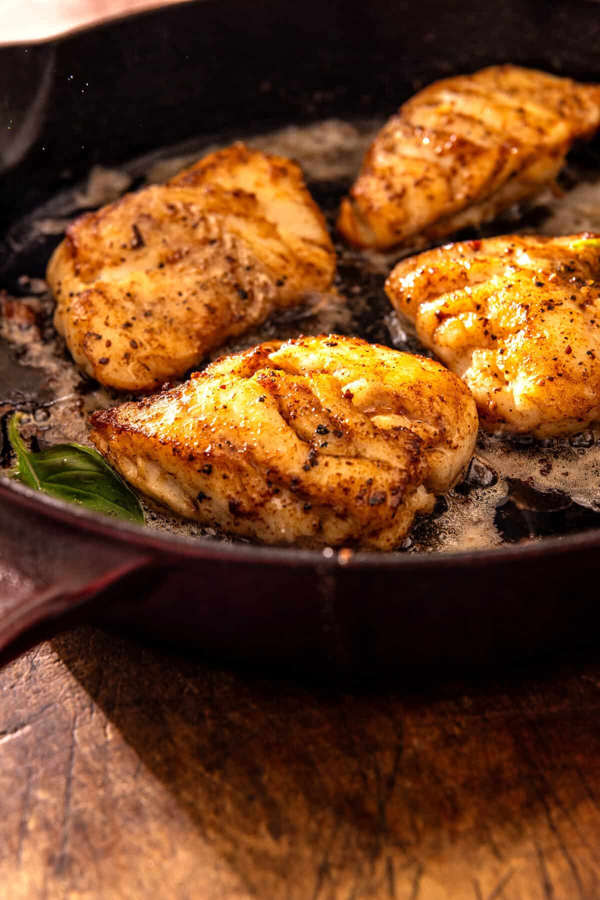 Garlic Butter Cod Florentine with White Wine Cream Sauce | halfbakedharvest.com