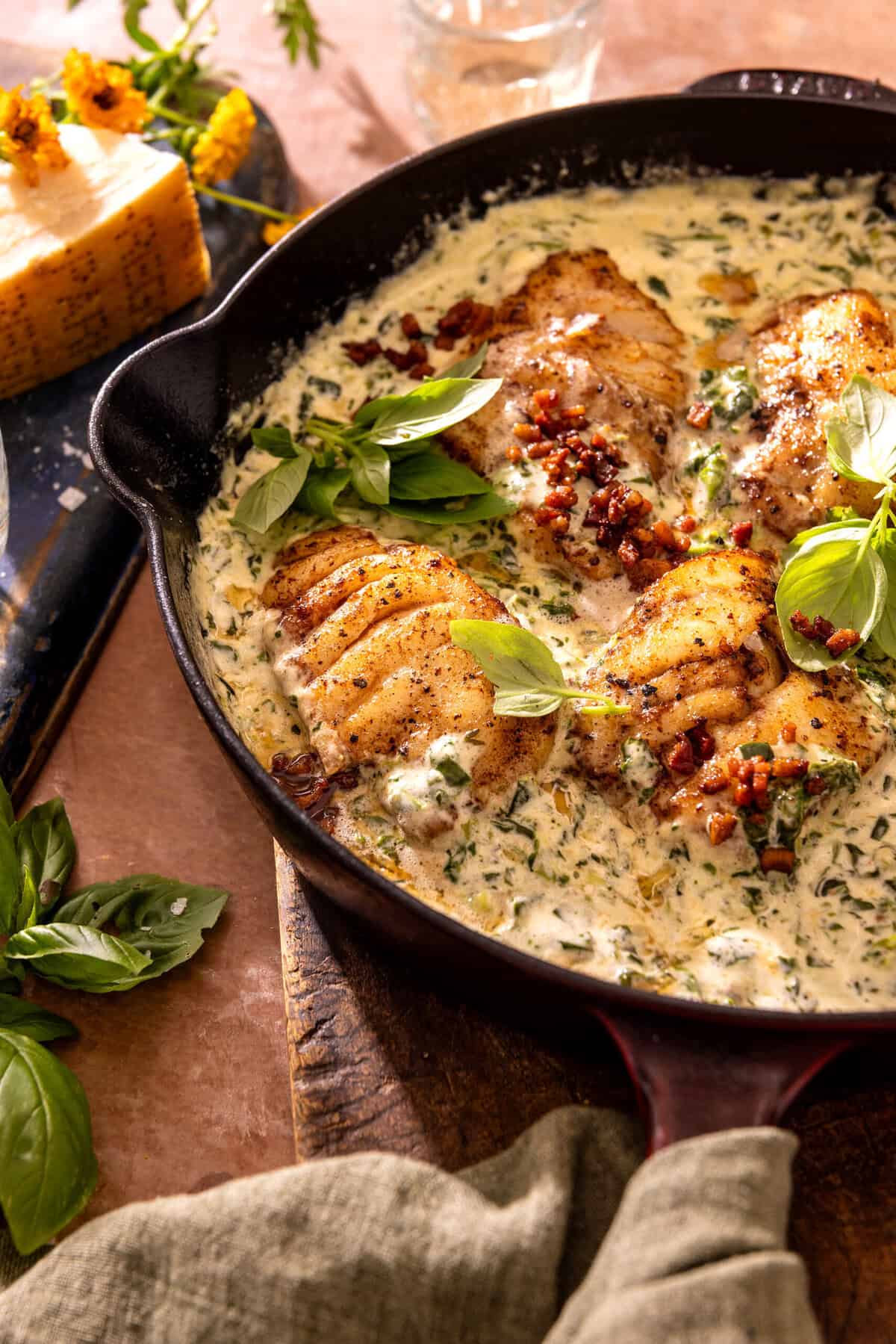 Garlic Butter Cod Florentine with White Wine Cream Sauce | halfbakedharvest.com